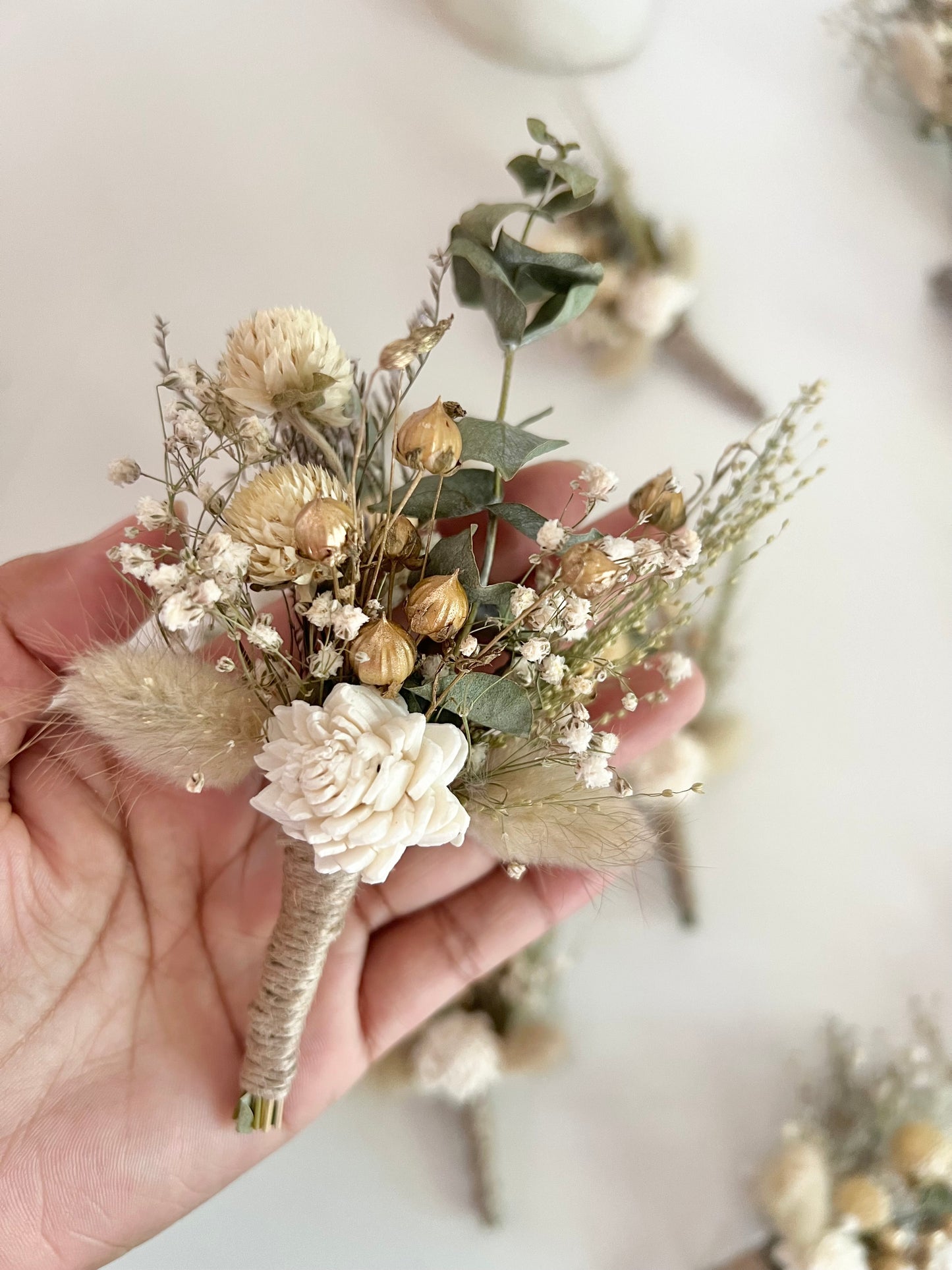 Sage green boutonniere